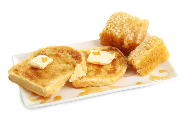 Білий хліб тости з медом на тарілці, ізольовані на білому — стокове фото