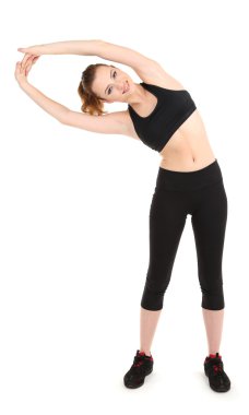 Beyazlar üzerinde izole edilmiş spor yapan genç bir kadın.