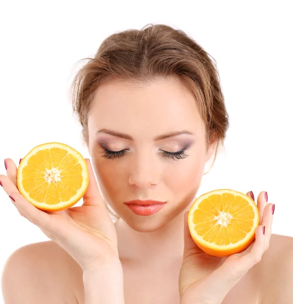 Beautiful young woman with bright make-up, holding orange, isolated on white — Stock Photo, Image