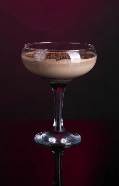 Cream cocktail on dark purple background — Stock Photo, Image