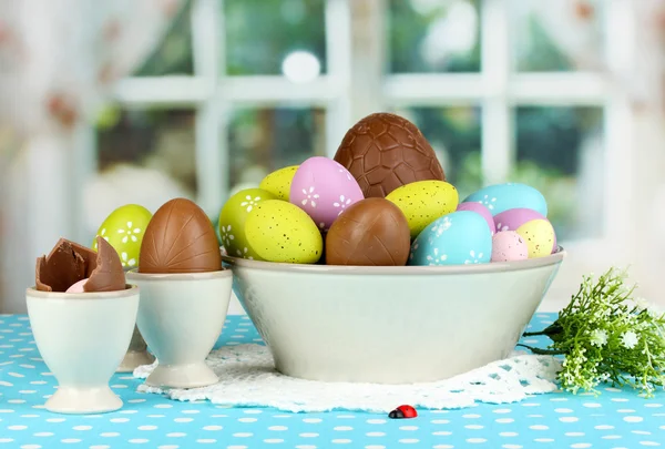 Composition of Easter and chocolate eggs on window background — Stock Photo, Image