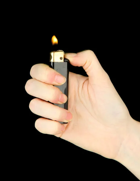 Burning lighter in female hand, isolated on black — Stock Photo, Image