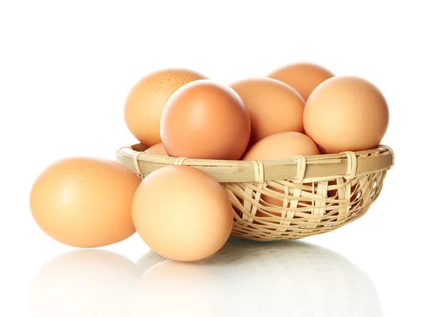 Many eggs in basket isolated on white — Stock Photo, Image