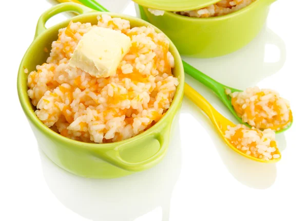 Taste rice porridge with pumpkin in saucepans, isolated on white — Stock Photo, Image