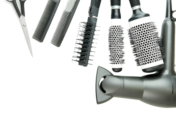 Comb brushes, hairdryer and cutting shears, isolated on white — Stock Photo, Image