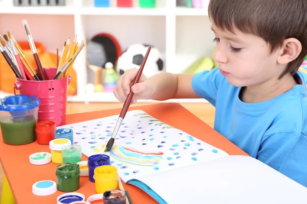 Cute little boy painting in his album — Stock Photo, Image