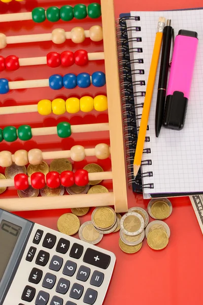 Bright wooden abacus and calculator. Conceptual photo of old and modern business — Stock Photo, Image