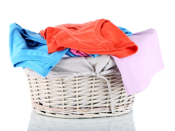 Clothes in wooden basket isolated on white — Stock Photo, Image