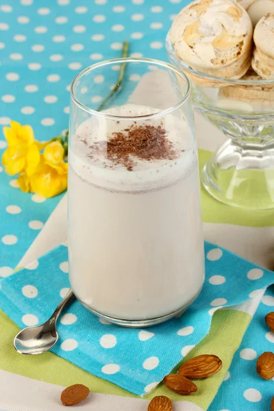 Glass of chocolate-cream cocktail on blue tablecloth close-up — Stock Photo, Image