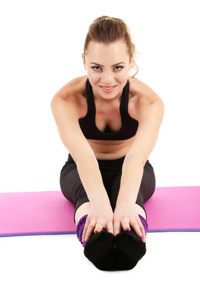 Mujer joven haciendo ejercicios de acondicionamiento físico aislado en blanco —  Fotos de Stock
