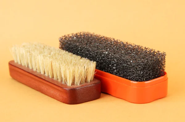 Brushes for shoes cleaning, on color background — Stock Photo, Image