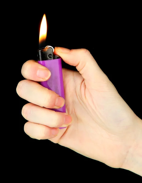 Burning lighter in female hand, isolated on black — Stock Photo, Image