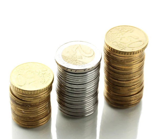 Many coins in columns isolated on white — Stock Photo, Image