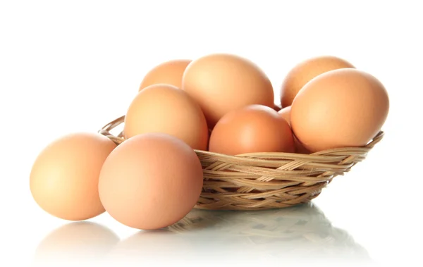 Many eggs in basket isolated on white — Stock Photo, Image