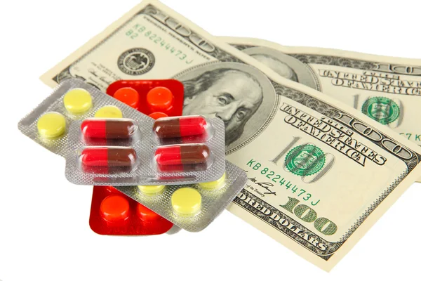 Pills and money isolated on white — Stock Photo, Image