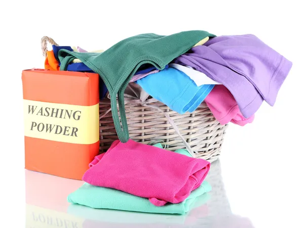 Clothes with washing powder in wooden basket isolated on white — Stock Photo, Image