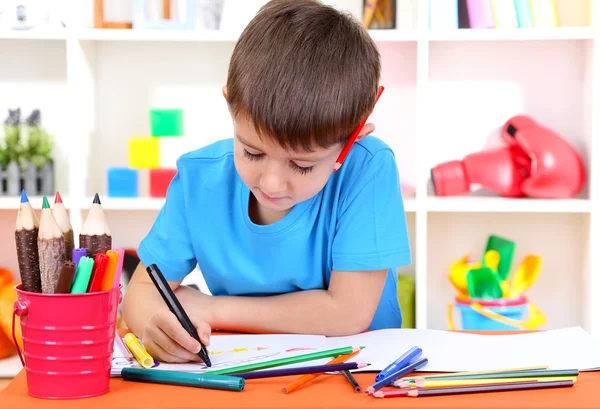 Cute little boy drawing in his album — Stock Photo, Image