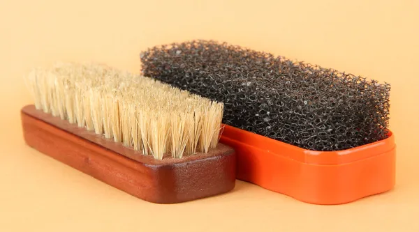 Brushes for shoes cleaning, on color background — Stock Photo, Image