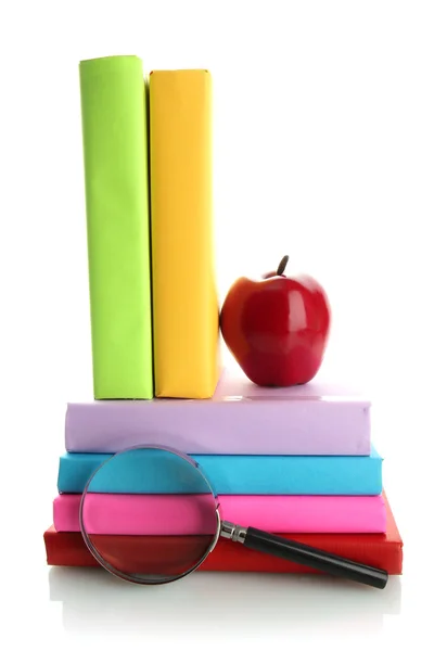 Libros de color con lupa aislada en blanco — Foto de Stock