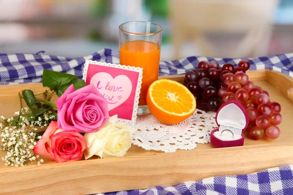 Breakfast in bed on Valentine's Day on room background — Stock Photo, Image