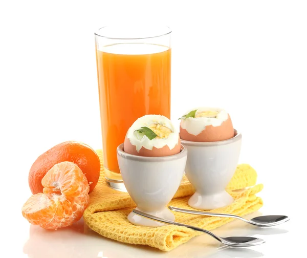 Light breakfast with boiled eggs and glass of juice, isolated on white — Stock Photo, Image