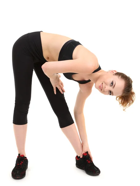 Mujer joven haciendo ejercicios de acondicionamiento físico aislado en blanco — Foto de Stock