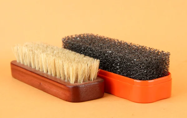 Brushes for shoes cleaning, on color background — Stock Photo, Image