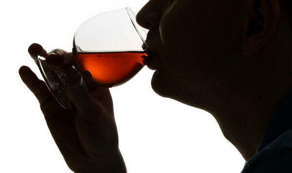 Silhouette of man drinking alcohol, isolated on white