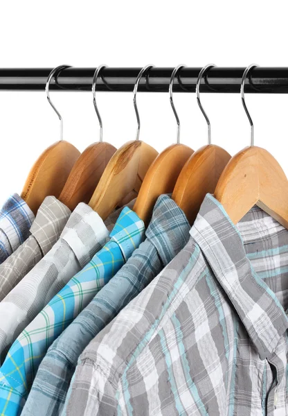 Shirts with ties on wooden hangers isolated on white — Stock Photo, Image