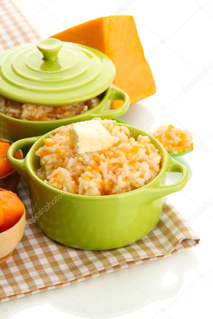 Taste rice porridge with pumpkin in saucepans, isolated on white