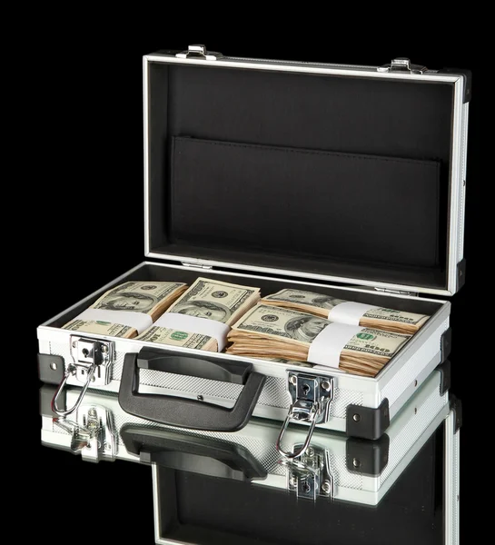 Suitcase with 100 dollar bills on black background — Stock Photo, Image