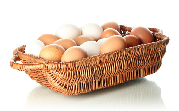 Many eggs in basket isolated on white