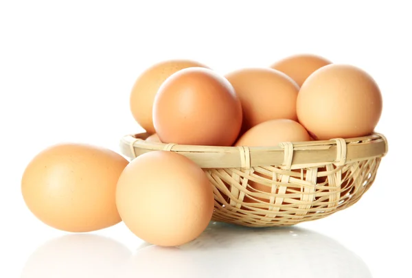 Many eggs in basket isolated on white — Stock Photo, Image