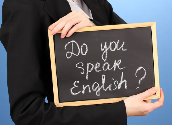 Young woman holding sign Do you speak english? — Stock Photo, Image