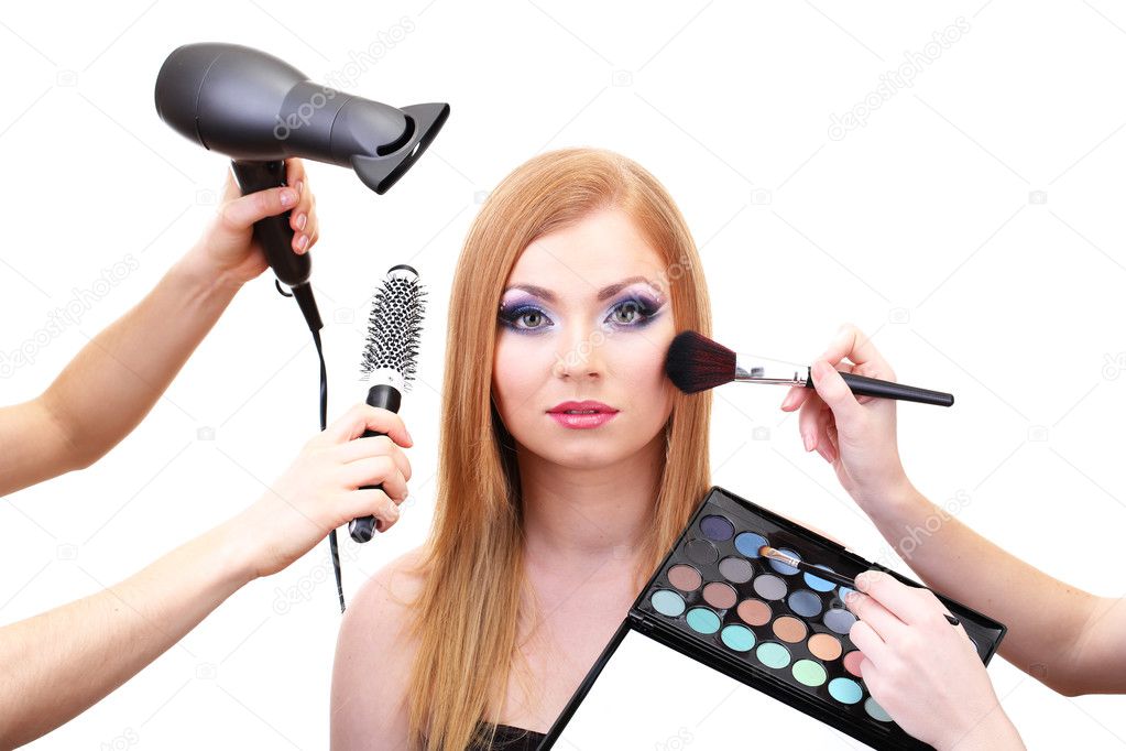 Beautiful young woman and hands with eyes shadows, brush and hairdryer, isolated on white