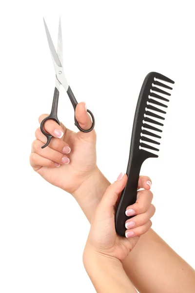 Color comb and scissors in female hand, isolated on white — Stock Photo, Image