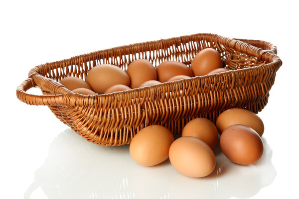Many eggs in basket isolated on white