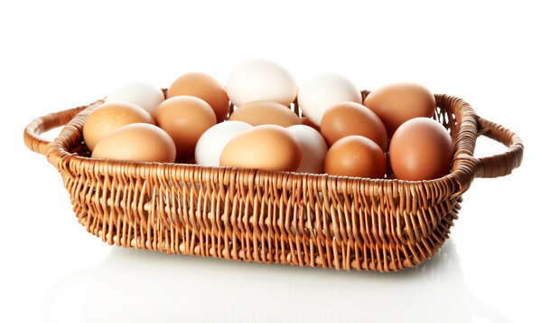Many eggs in basket isolated on white