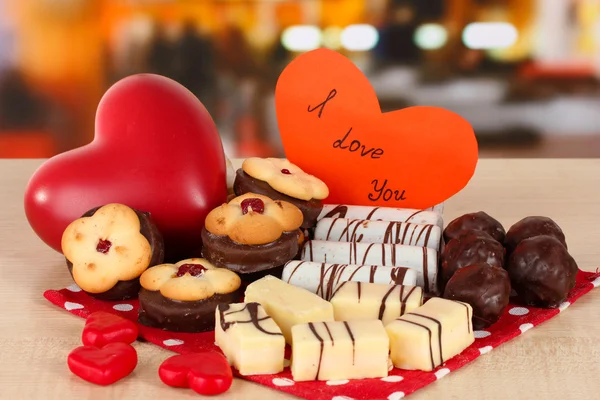 Sweet cookies with hearts and valentine card on table in cafe Stock Picture