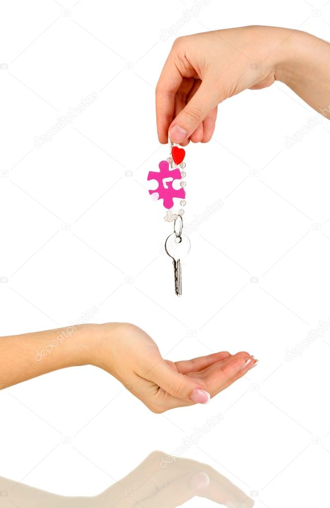 Transfer of house keys isolated on white