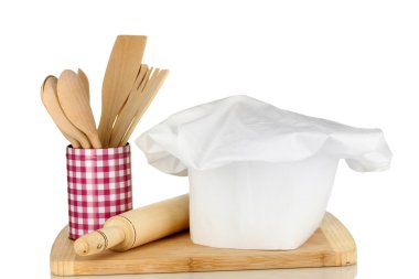 şef şapkasını kaşıkları ve üzerinde beyaz izole battledore