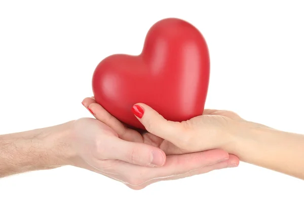 Kadın ve adam ellerini, üzerinde beyaz izole kırmızı kalp — Stok fotoğraf