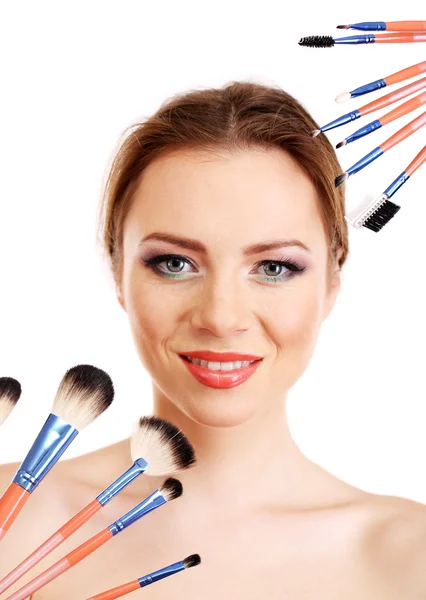 Portrait of beautiful woman with make-up brushes, isolated on white — Stock Photo, Image