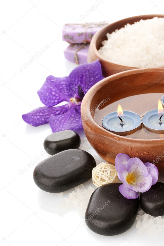 Beautiful spa setting with flowers, isolated on white
