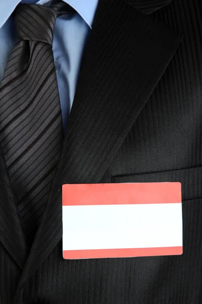 Blank nametag on businessman's black suit close up — Stock Photo, Image