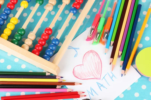 Toy abacus, note paper, pencils on bright background — Stock Photo, Image