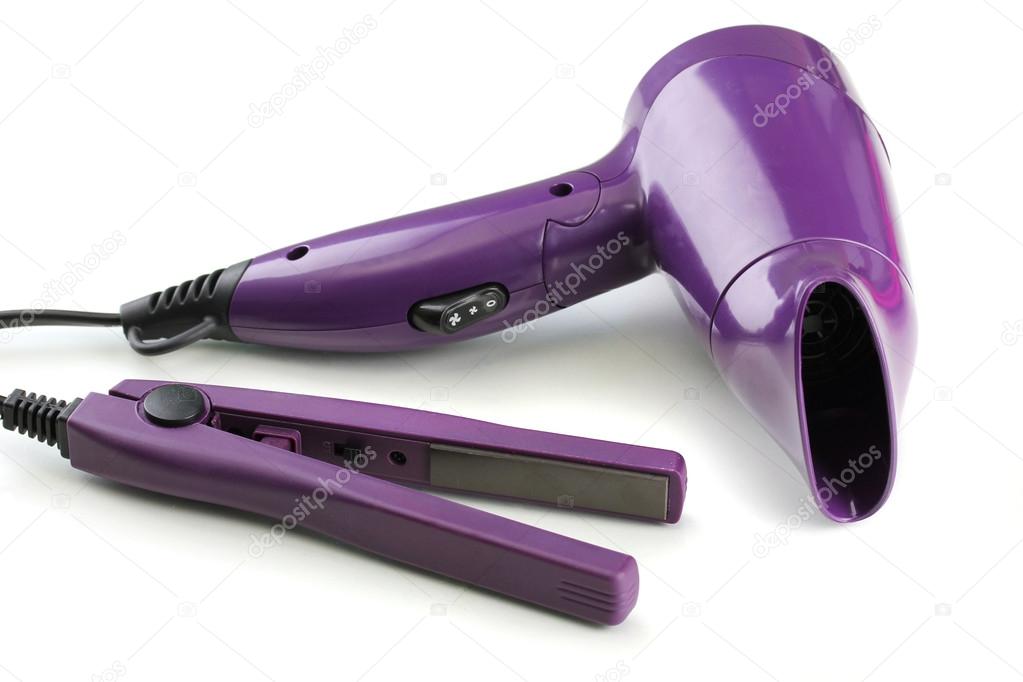 Hair dryer and straighteners , isolated on white