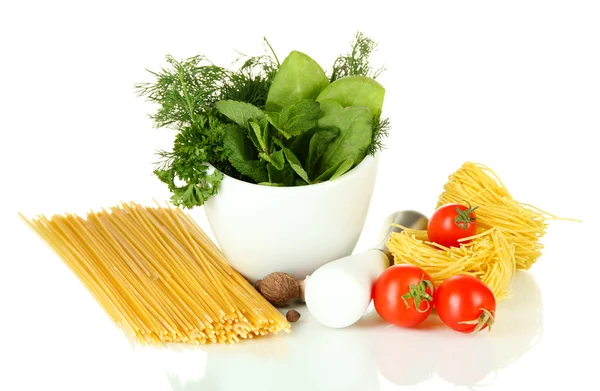 Composition of mortar, pasta and green herbals, isolated on white — Stock Photo, Image