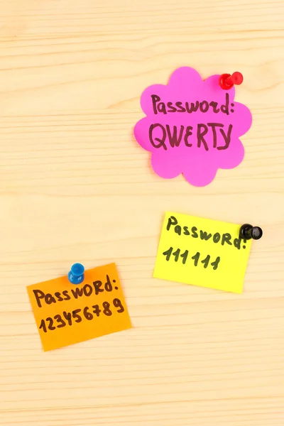 Stickers-reminders with most popular passwords, on wooden background — Stock Photo, Image