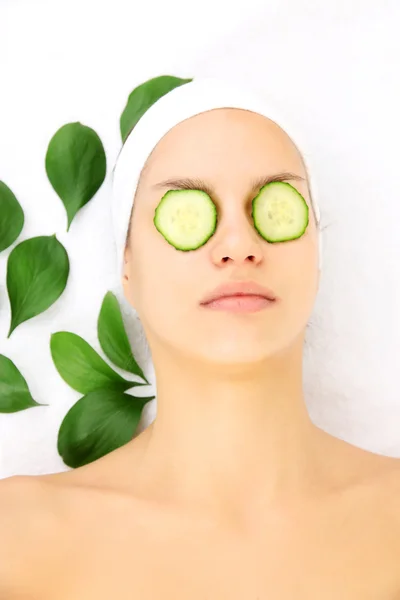 Young woman with creamy facial mask — Stock Photo, Image